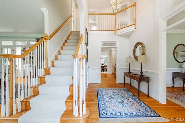 9929 Eildonway Pl, Henrico, VA 23238 - foyer featuring stairs, wood finished floors, a towering ceiling, and a chandelier