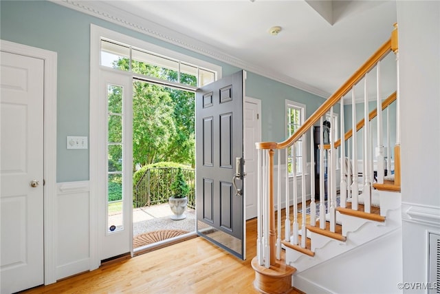9929 Eildonway Pl, Henrico, VA 23238 - entrance foyer featuring wood finished floors, healthy amount of natural light, stairway, and ornamental molding