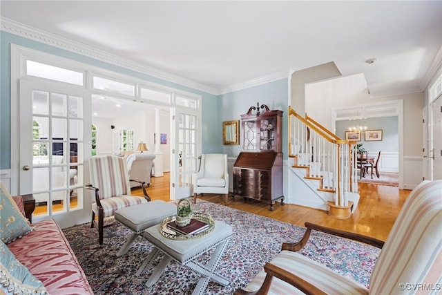 9929 Eildonway Pl, Henrico, VA 23238 - living area with french doors, a chandelier, wood finished floors, stairs, and ornamental molding