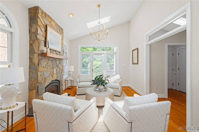 9929 Eildonway Pl, Henrico, VA 23238 - living area with a skylight, light wood finished floors, lofted ceiling, and a fireplace
