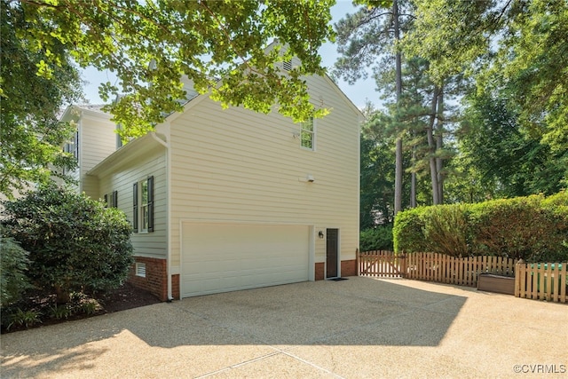 9929 Eildonway Pl, Henrico, VA 23238 - view of property exterior featuring concrete driveway, a garage, and brick siding