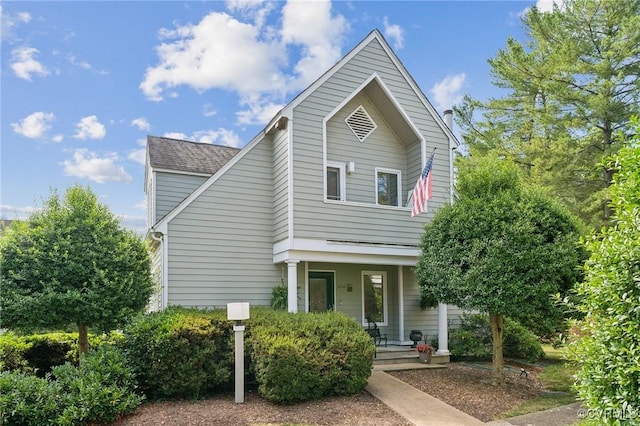 8256 Greystone W Cir, Henrico, VA 23229 - traditional-style house with a porch and a chimney