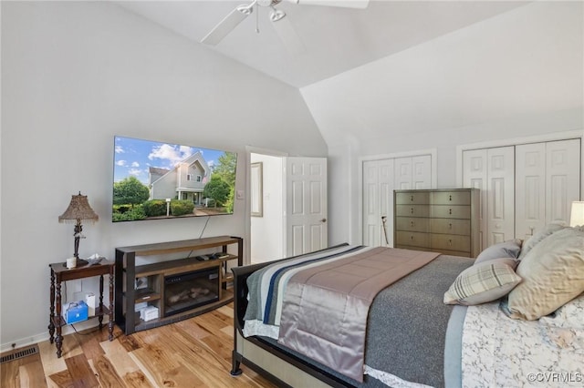 8256 Greystone W Cir, Henrico, VA 23229 - bedroom with multiple closets, wood finished floors, lofted ceiling, and a ceiling fan
