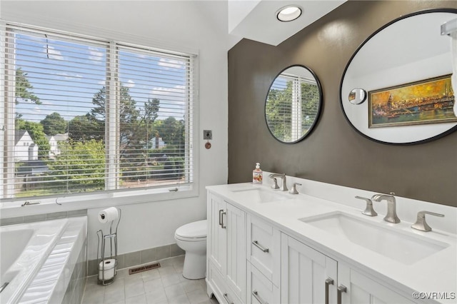 8256 Greystone W Cir, Henrico, VA 23229 - bathroom with healthy amount of natural light, double vanity, tile patterned flooring, and a garden tub
