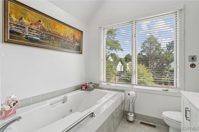 8256 Greystone W Cir, Henrico, VA 23229 - bathroom with a whirlpool tub, tile patterned flooring, lofted ceiling, and vanity