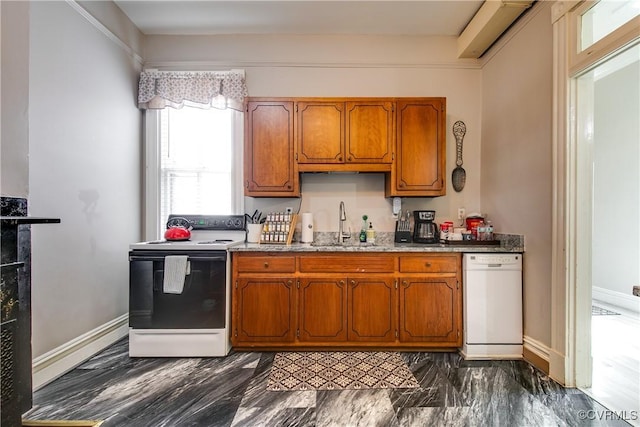 1320 W Main St, Richmond, VA 23220 - kitchen with white appliances, brown cabinetry, and light stone counters