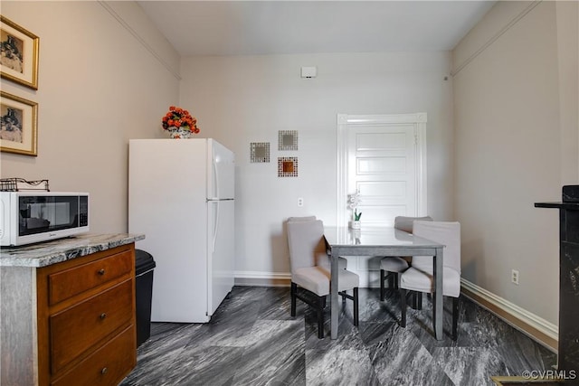 1320 W Main St, Richmond, VA 23220 - kitchen featuring white appliances, brown cabinets, and light countertops