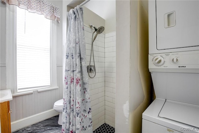 1320 W Main St, Richmond, VA 23220 - bathroom with stacked washer and clothes dryer, a shower stall, and vanity