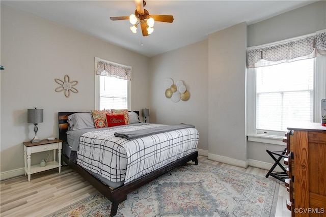 1320 W Main St, Richmond, VA 23220 - bedroom featuring multiple windows, wood finished floors, and a ceiling fan