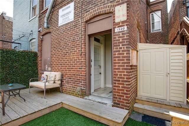 1320 W Main St, Richmond, VA 23220 - entrance to property featuring brick siding and a wooden deck