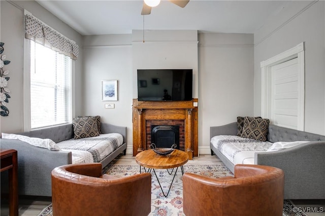 1320 W Main St, Richmond, VA 23220 - living room featuring ceiling fan, light wood finished floors, and a fireplace