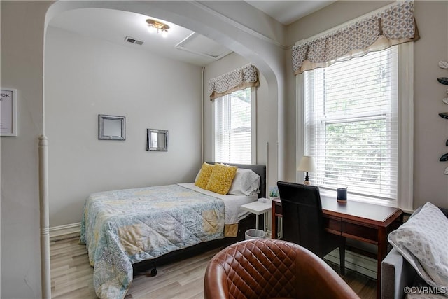 1320 W Main St, Richmond, VA 23220 - bedroom with arched walkways and wood finished floors