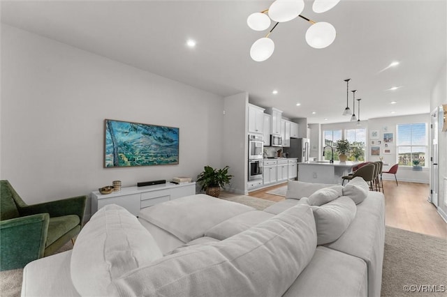 2133 Cantina Ln, Midlothian, VA 23114 - living area with recessed lighting, light wood-style flooring, and a chandelier