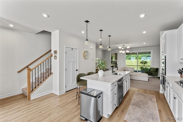 2133 Cantina Ln, Midlothian, VA 23114 - kitchen with open floor plan, appliances with stainless steel finishes, white cabinetry, a center island with sink, and light countertops