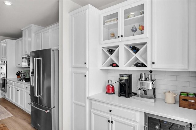 2133 Cantina Ln, Midlothian, VA 23114 - kitchen with stainless steel appliances, beverage cooler, and white cabinets