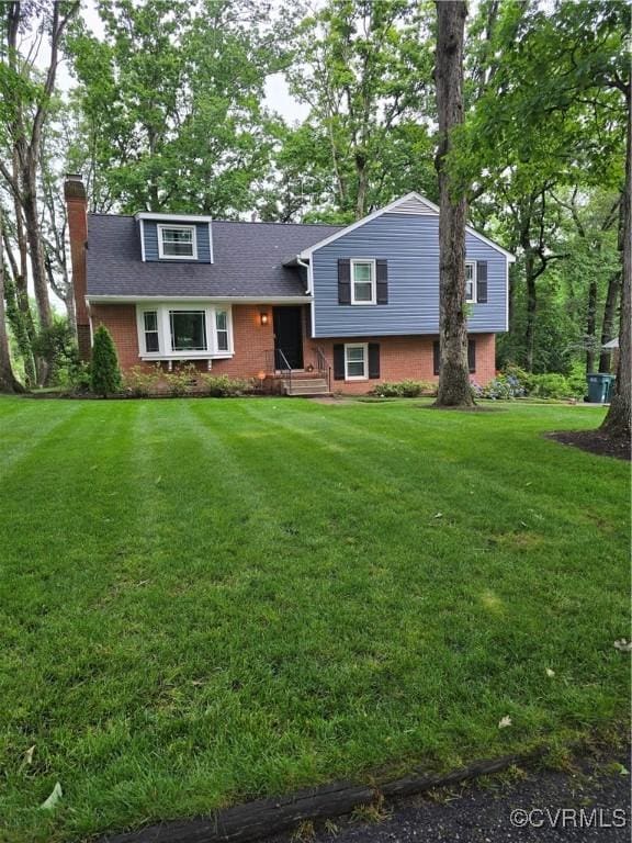 1906 Parma Rd, Richmond, VA 23229 - tri-level home with a chimney, a front yard, and roof with shingles