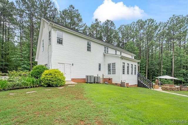24000 Pear Orchard Rd, Moseley, VA 23120 - rear view of house featuring a yard, crawl space, stairs, and a fire pit