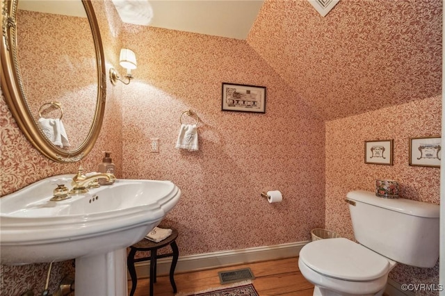 88 Holly Grv, Jamestown, VA 23185 - half bathroom with toilet and wood finished floors