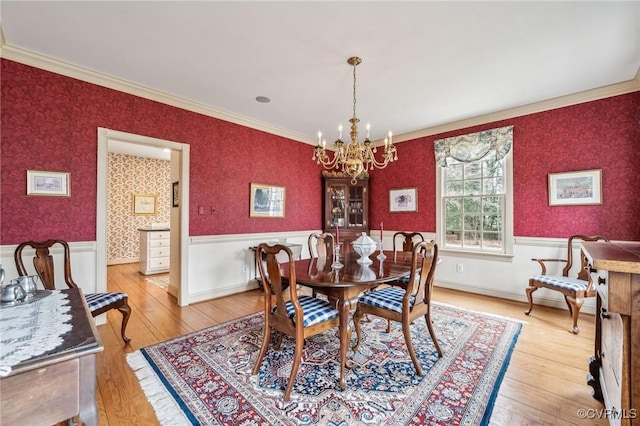88 Holly Grv, Jamestown, VA 23185 - dining room featuring a wainscoted wall, a chandelier, wood finished floors, crown molding, and wallpapered walls