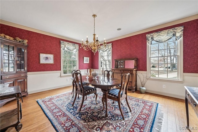 88 Holly Grv, Jamestown, VA 23185 - dining room with a chandelier, light wood finished floors, ornamental molding, and wainscoting