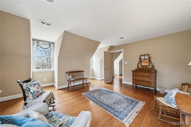 88 Holly Grv, Jamestown, VA 23185 - sitting room featuring wood finished floors and vaulted ceiling