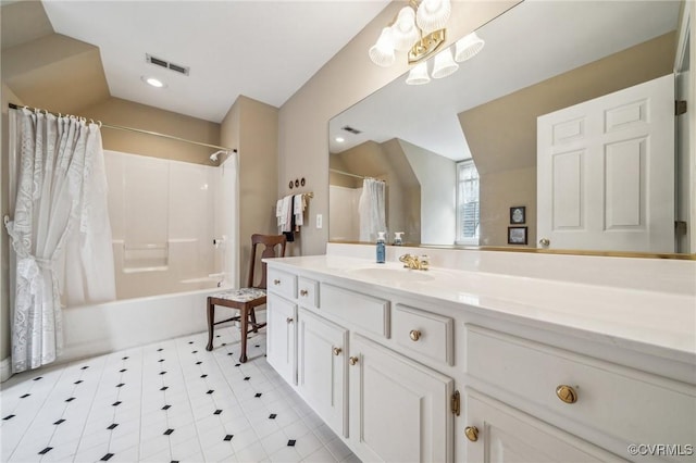 88 Holly Grv, Jamestown, VA 23185 - full bath with vanity, shower / bath combo with shower curtain, a chandelier, vaulted ceiling, and tile patterned floors