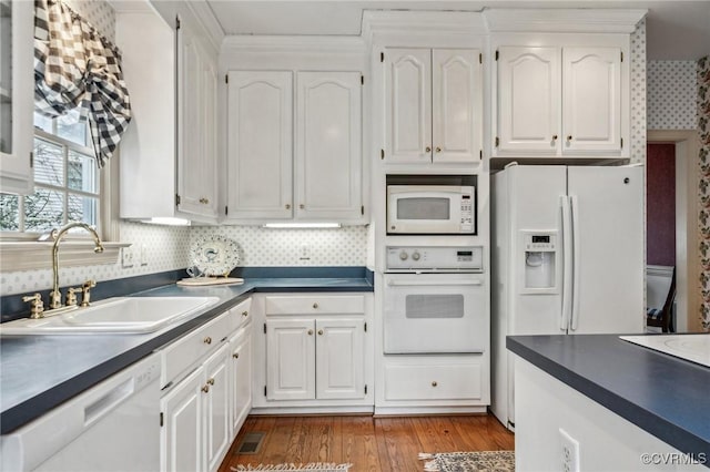 88 Holly Grv, Jamestown, VA 23185 - kitchen with white appliances, dark countertops, and white cabinets