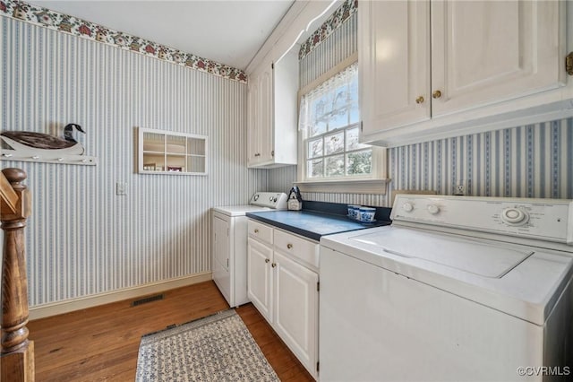 88 Holly Grv, Jamestown, VA 23185 - washroom with wallpapered walls, cabinet space, dark wood-type flooring, and independent washer and dryer