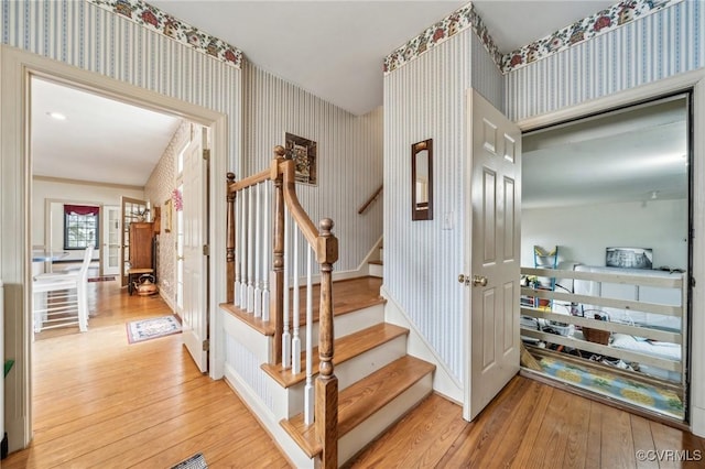 88 Holly Grv, Jamestown, VA 23185 - stairway with wallpapered walls and wood-type flooring