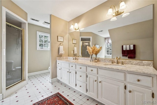 88 Holly Grv, Jamestown, VA 23185 - full bath with double vanity, a shower stall, and a chandelier