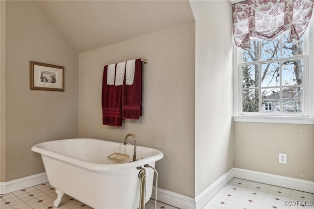 88 Holly Grv, Jamestown, VA 23185 - full bath with a soaking tub, lofted ceiling, and tile patterned floors