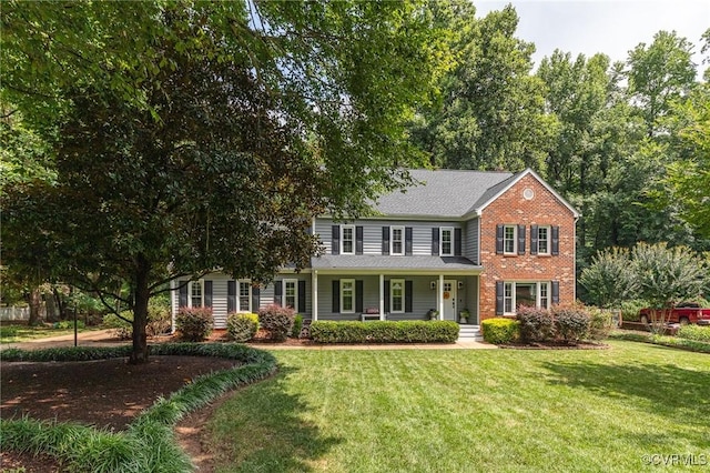 13904 Sunrise Bluff Rd, Chesterfield, VA 23112 - view of front of home with brick siding, a front lawn, and a porch