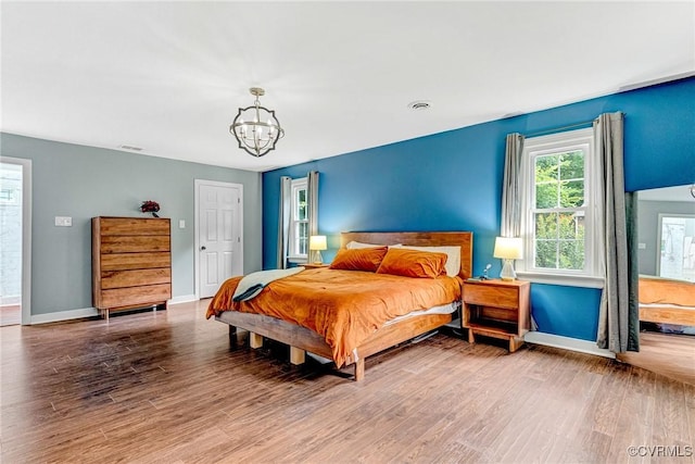 13904 Sunrise Bluff Rd, Chesterfield, VA 23112 - bedroom featuring a chandelier and wood finished floors
