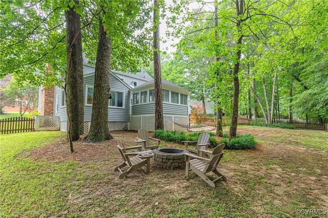 13904 Sunrise Bluff Rd, Chesterfield, VA 23112 - fenced backyard featuring an outdoor fire pit and a sunroom