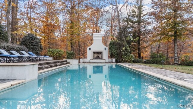 3808 Solebury Pl, Midlothian, VA 23113 - swimming pool featuring an outdoor fireplace