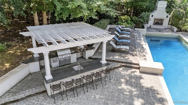 3808 Solebury Pl, Midlothian, VA 23113 - view of swimming pool featuring exterior kitchen, exterior fireplace, a bar, and a patio