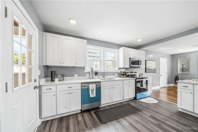 21405 Chesterfield Ave, Chesterfield, VA 23803 - kitchen featuring stainless steel appliances, dark wood finished floors, white cabinetry, light countertops, and recessed lighting