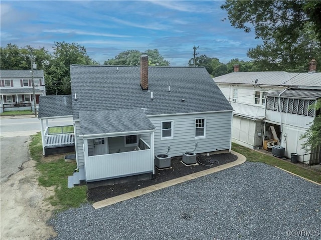 21405 Chesterfield Ave, Chesterfield, VA 23803 - rear view of property with roof with shingles and a chimney