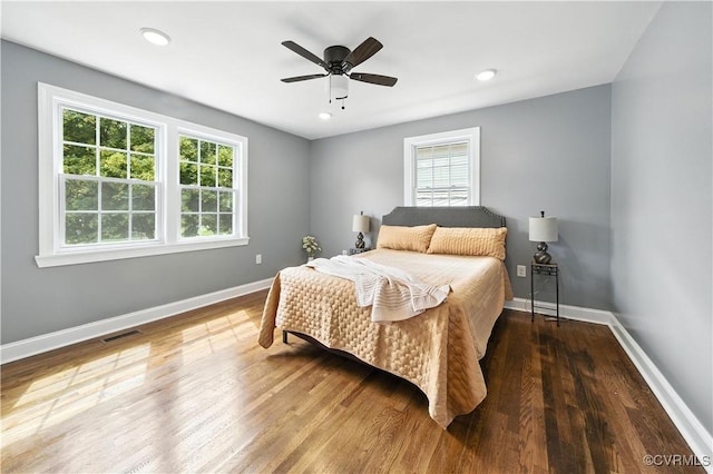 21405 Chesterfield Ave, Chesterfield, VA 23803 - bedroom with multiple windows, wood finished floors, a ceiling fan, and recessed lighting