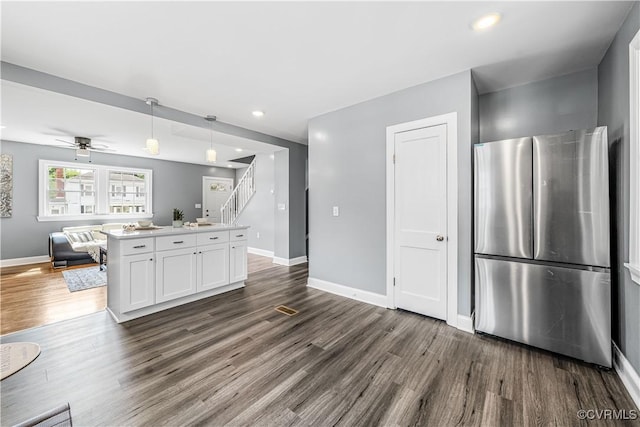 21405 Chesterfield Ave, Chesterfield, VA 23803 - kitchen with freestanding refrigerator, open floor plan, dark wood-style flooring, white cabinets, and recessed lighting