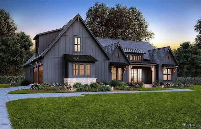 18122 Dogwood Trail Way, Hanover, VA 23146 - back of house at dusk featuring a lawn, board and batten siding, a standing seam roof, a shingled roof, and a metal roof