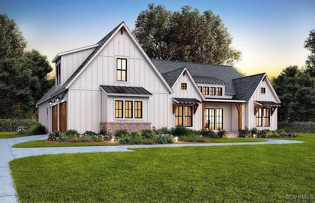 18122 Dogwood Trail Way, Hanover, VA 23146 - modern farmhouse style home with board and batten siding, a standing seam roof, a lawn, concrete driveway, and a metal roof