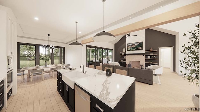 18122 Dogwood Trail Way, Hanover, VA 23146 - kitchen featuring dishwashing machine, a large fireplace, a chandelier, dark cabinetry, and light wood-style flooring