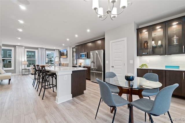 13213 Garland Ln, Midlothian, VA 23114 - dining room with a chandelier, light wood-style flooring, and recessed lighting