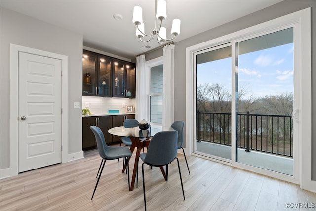 13213 Garland Ln, Midlothian, VA 23114 - dining room with a chandelier and light wood-style flooring