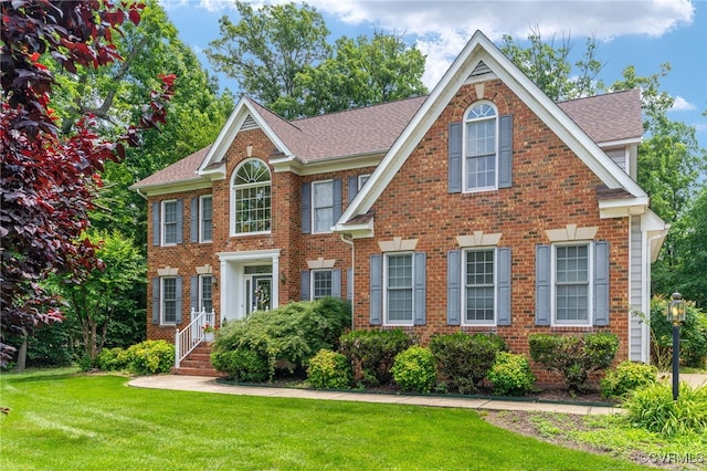 3541 Kings Farm Dr, Midlothian, VA 23113 - view of front of property with brick siding, a front yard, and a shingled roof