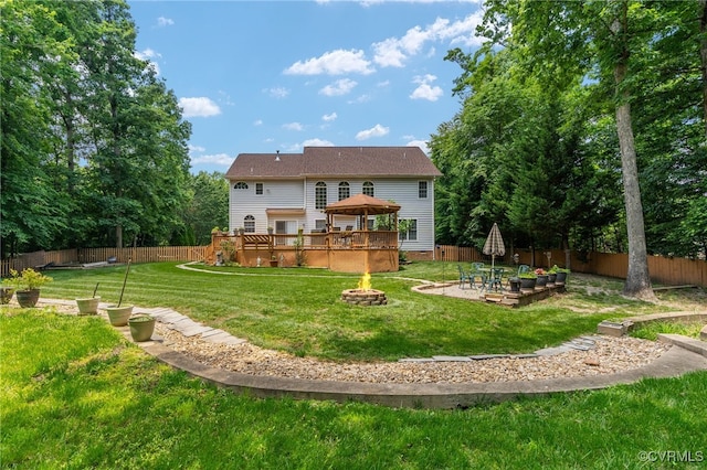 3541 Kings Farm Dr, Midlothian, VA 23113 - back of property with a fire pit, a gazebo, a wooden deck, a fenced backyard, and a patio area