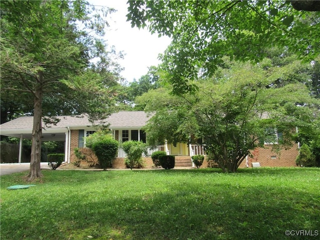 10212 Sauna Dr, North Chesterfield, VA 23236 - view of front of property with an attached carport, brick siding, a front yard, and driveway