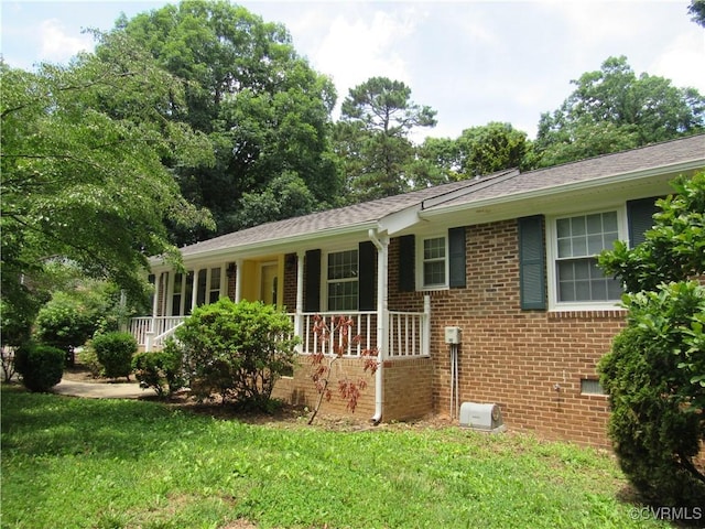10212 Sauna Dr, North Chesterfield, VA 23236 - ranch-style home with a porch, brick siding, a front yard, and a shingled roof