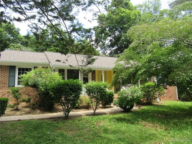 10212 Sauna Dr, North Chesterfield, VA 23236 - view of front of home with brick siding and a front lawn